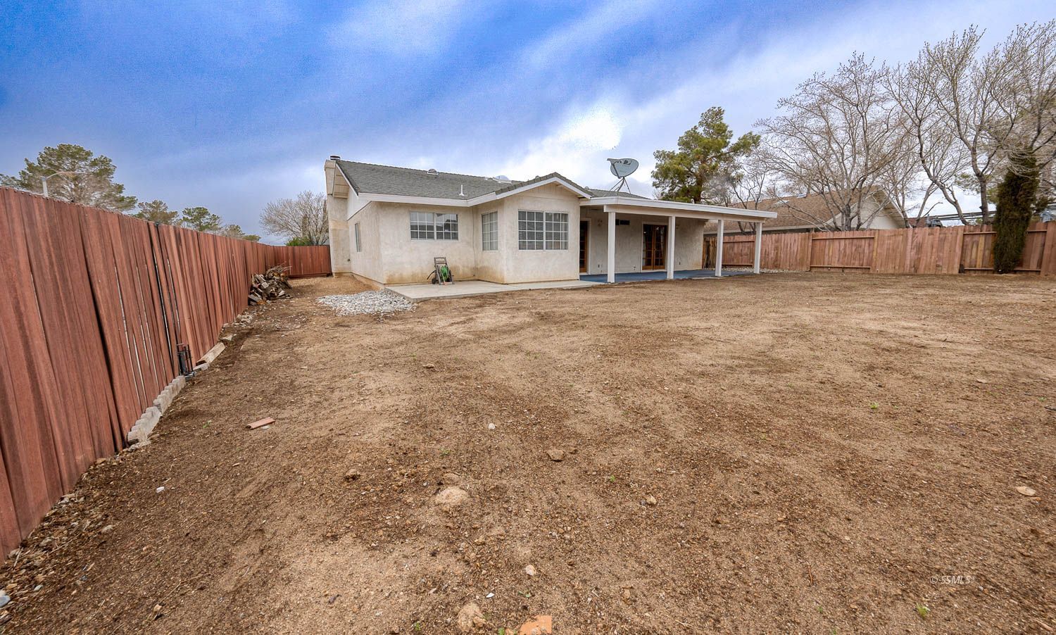 800 Valarie Street Ridgecrest, CA 93555 - Photo 38 of 39 a view of a house with backyard and trees