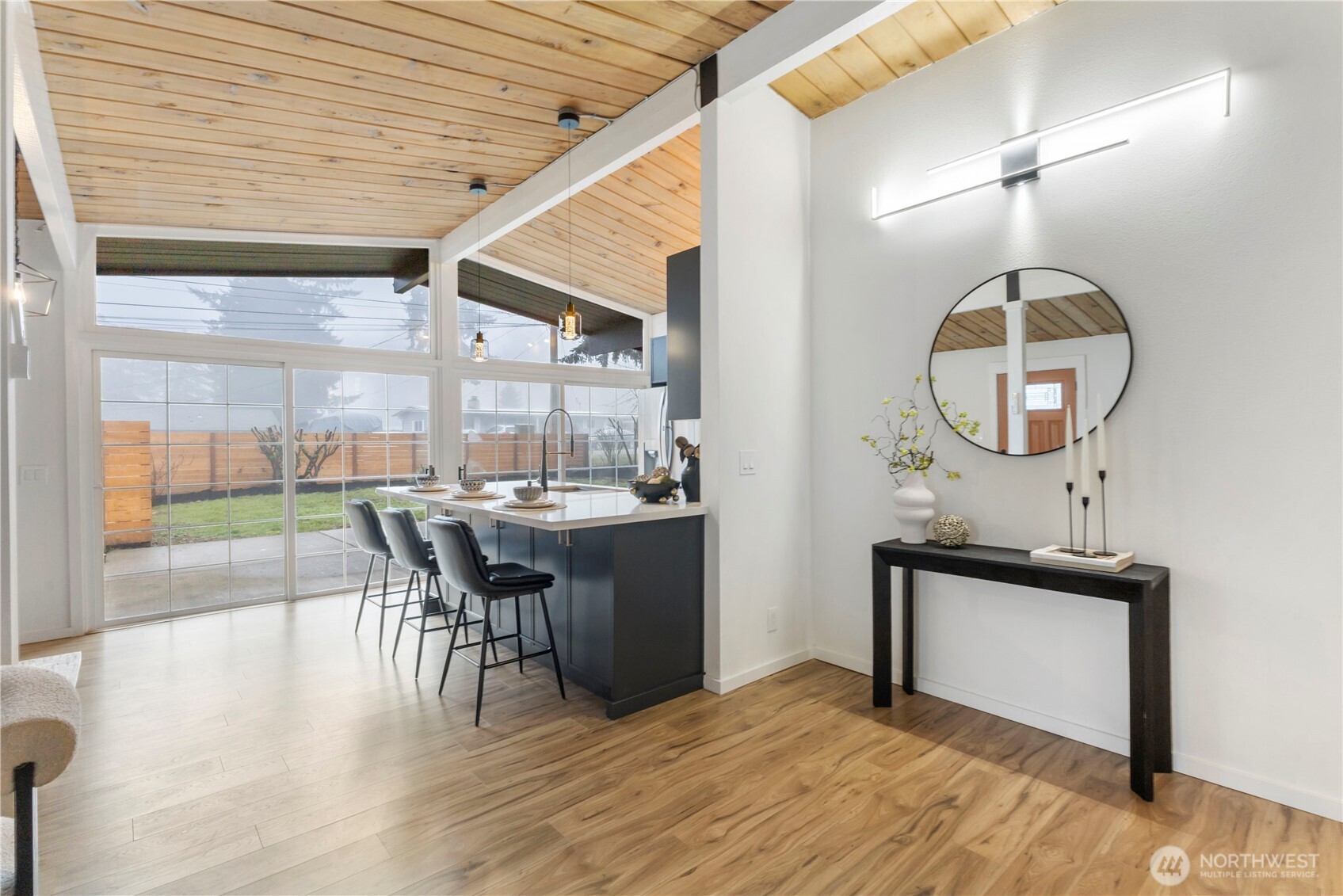 35631 13th Avenue Southwest Federal Way, WA 98023 - Photo 13 of 27 a dining room with wooden floor a glass table and chairs