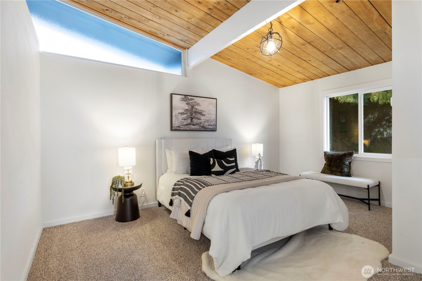 35631 13th Avenue Southwest Federal Way, WA 98023 - Photo 14 of 27 a bedroom with a bed and a chandelier