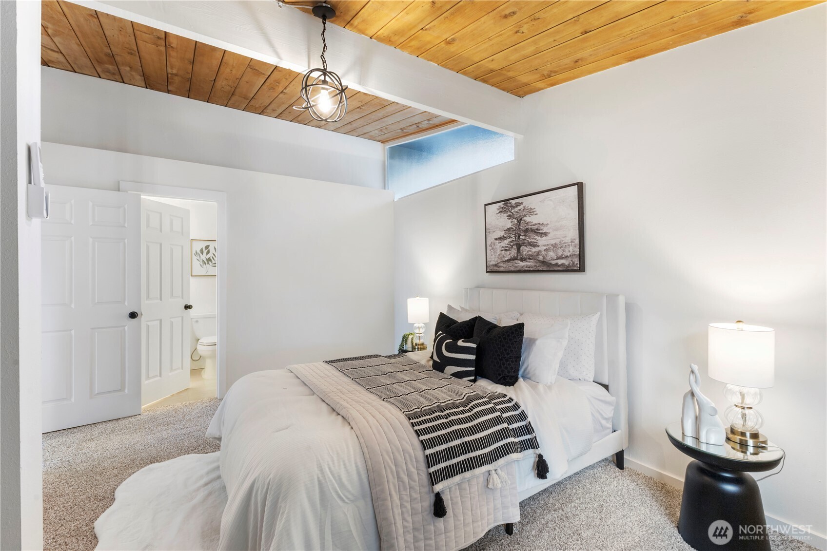 35631 13th Avenue Southwest Federal Way, WA 98023 - Photo 15 of 27 a bedroom with a bed and a lamp