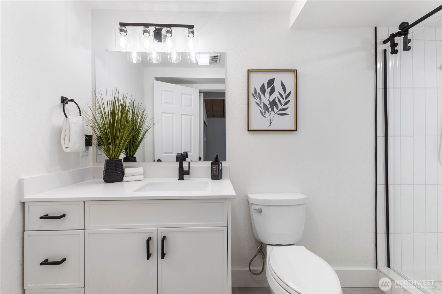 35631 13th Avenue Southwest Federal Way, WA 98023 - Photo 16 of 27 a bathroom with a toilet a sink and mirror