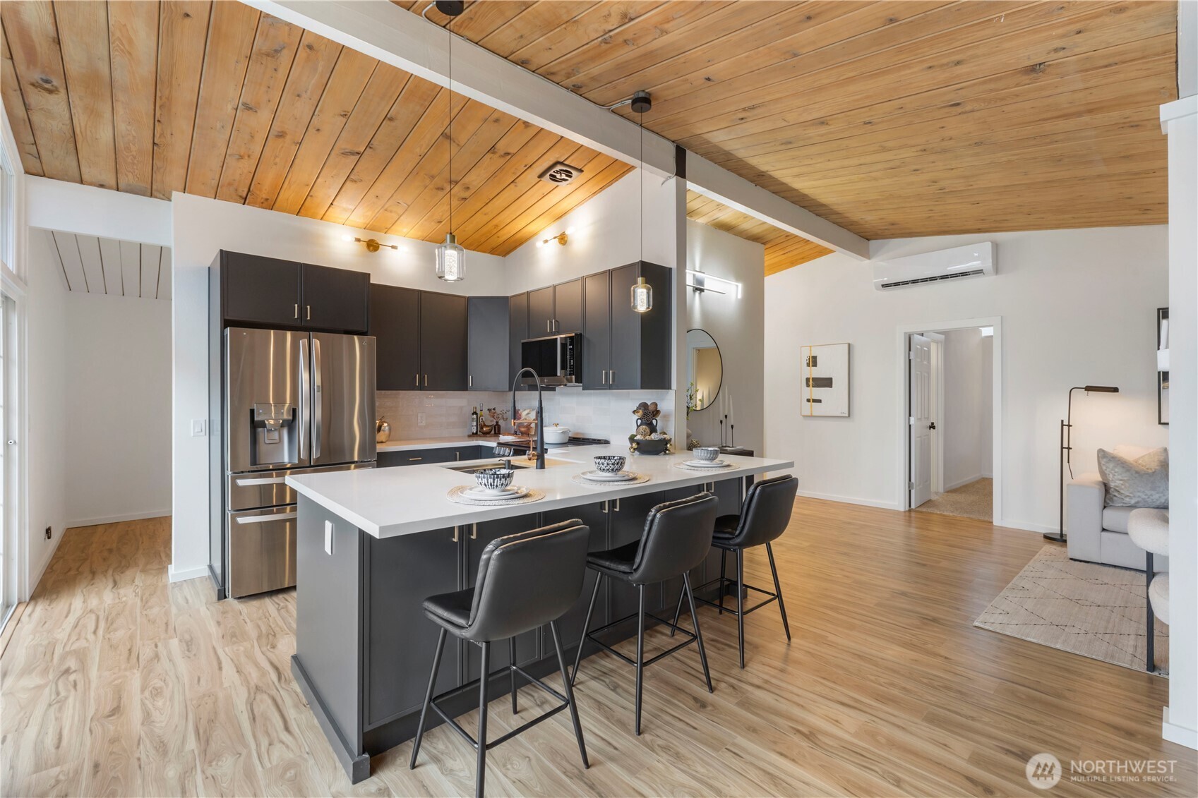 35631 13th Avenue Southwest Federal Way, WA 98023 - Photo 5 of 27 a kitchen with stainless steel appliances a table chairs refrigerator and sink
