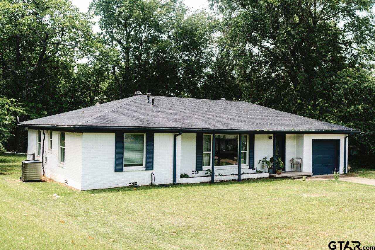 2411 Rodge Drive Tyler, TX 75701 - Photo 39 of 42 a backyard of a house with yard barbeque oven and outdoor seating