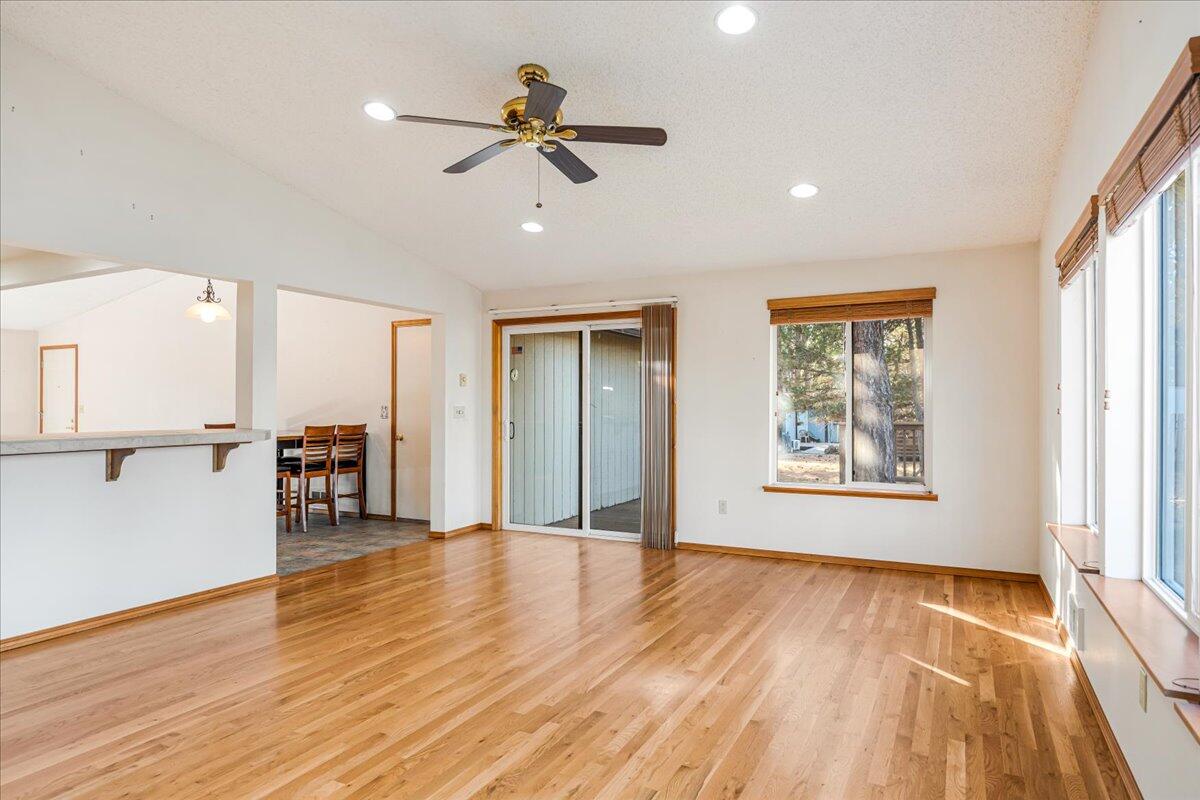 19304 Baker Road Bend, OR 97702 - Photo 8 of 38 This living room offers lots of natural light and a slider to you back deck