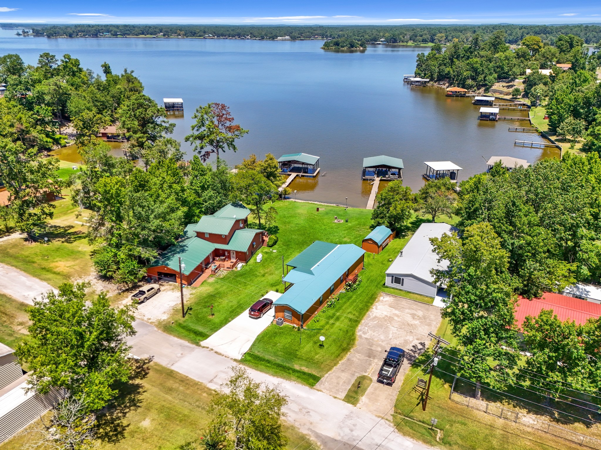 an aerial view of a house with a lake view