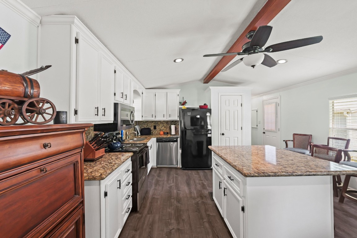 729 Lake Shore Drive Trinity, TX 75862 - Photo 13 of 38 a kitchen with granite countertop a sink stove and refrigerator