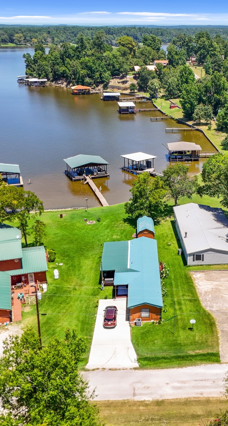 729 Lake Shore Drive Trinity, TX 75862 - Photo 2 of 38 an aerial view of residential houses with outdoor space and lake view