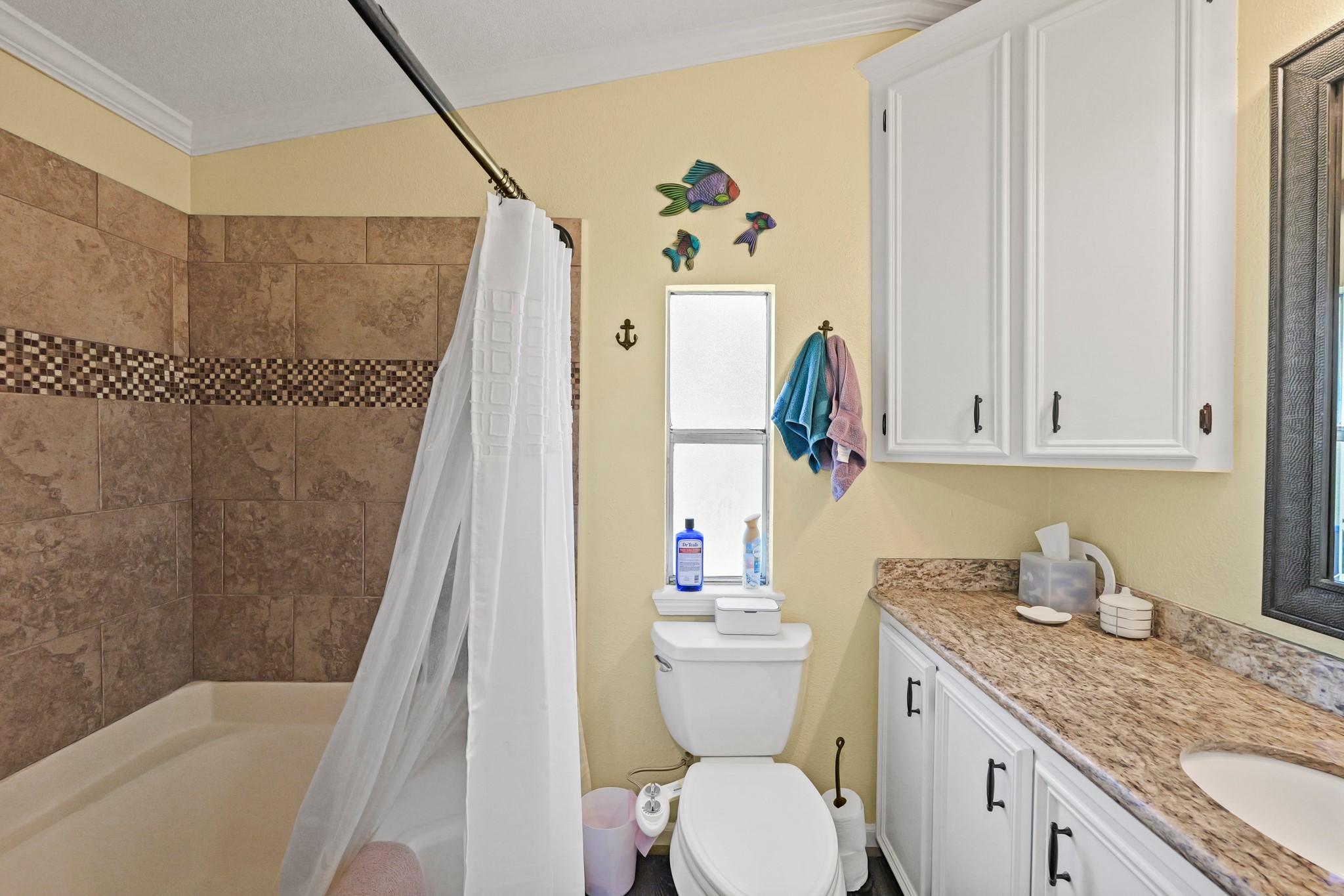 729 Lake Shore Drive Trinity, TX 75862 - Photo 22 of 38 a bathroom with a granite countertop sink toilet and shower