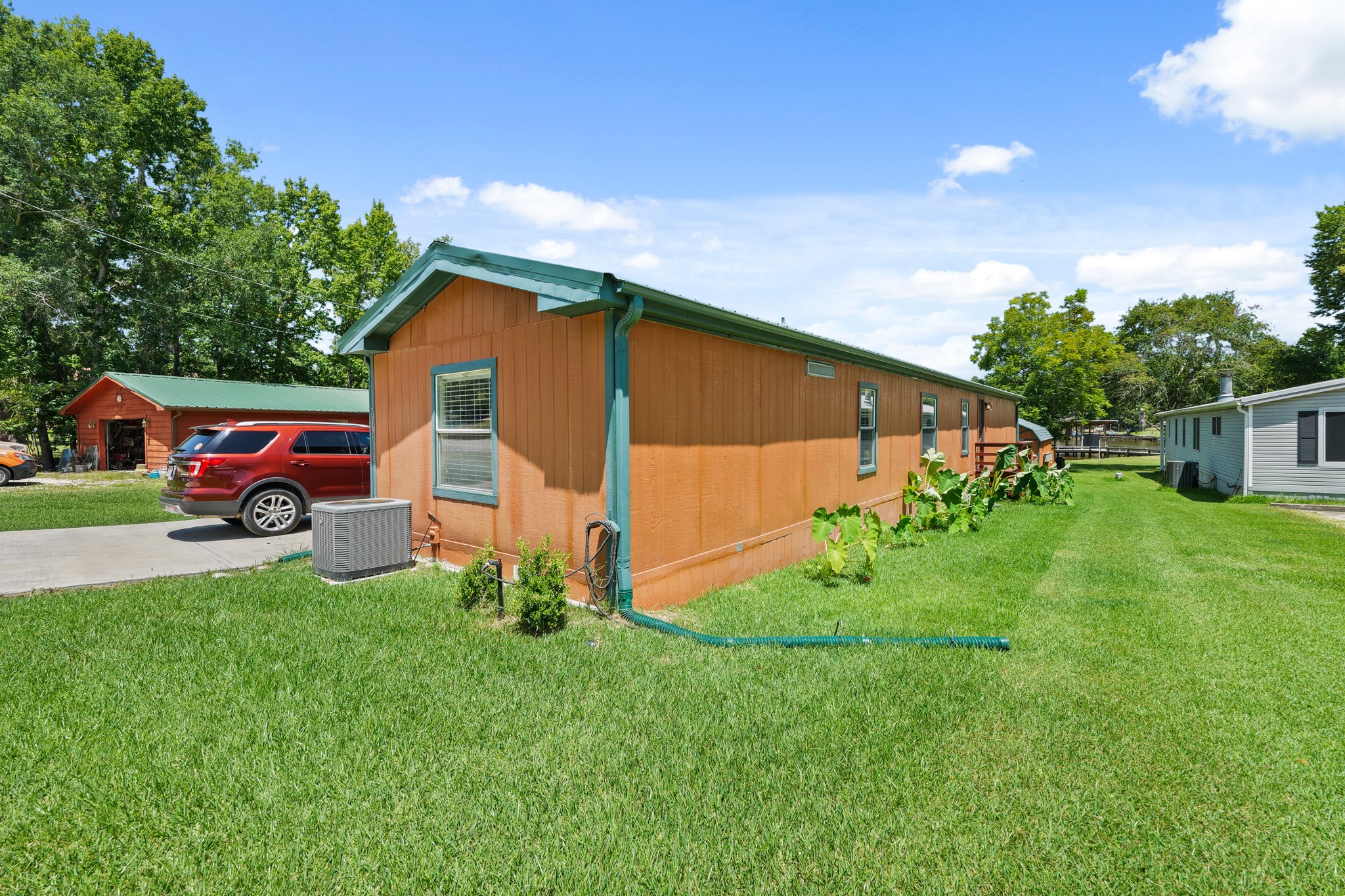 729 Lake Shore Drive Trinity, TX 75862 - Photo 26 of 38 a front view of a house with garden