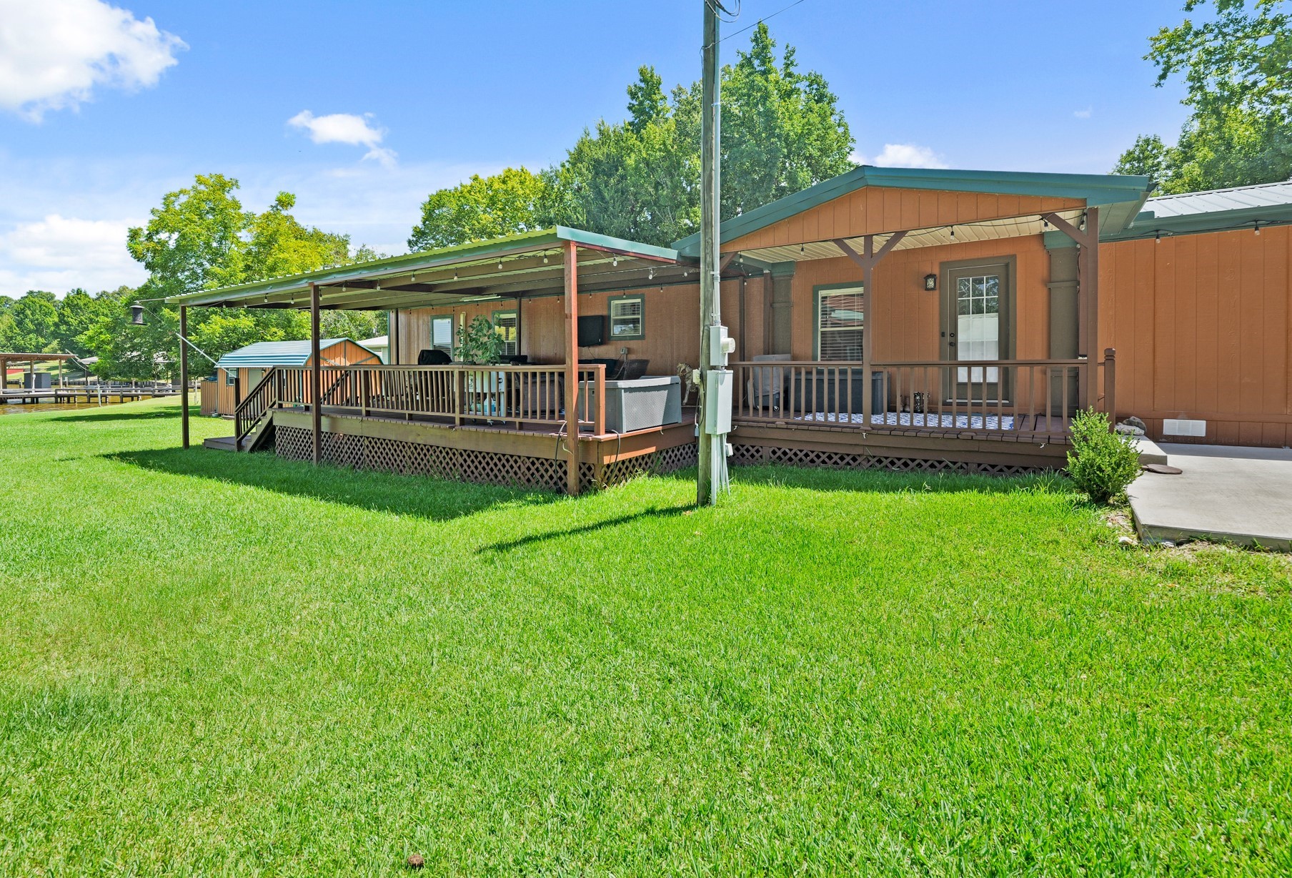 729 Lake Shore Drive Trinity, TX 75862 - Photo 4 of 38 a view of a house with a yard and deck