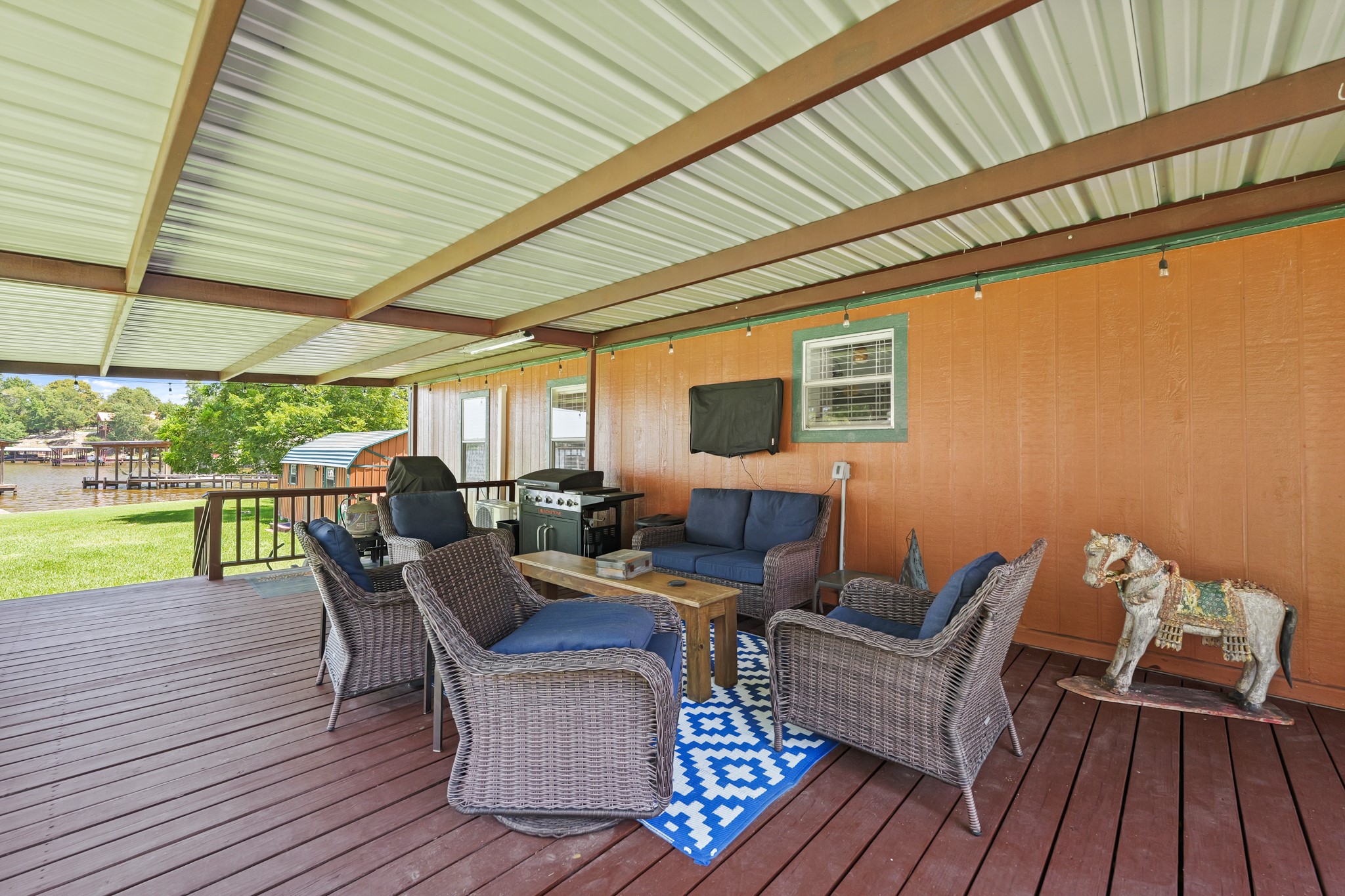 729 Lake Shore Drive Trinity, TX 75862 - Photo 7 of 38 a outdoor living space with furniture and wooden floor