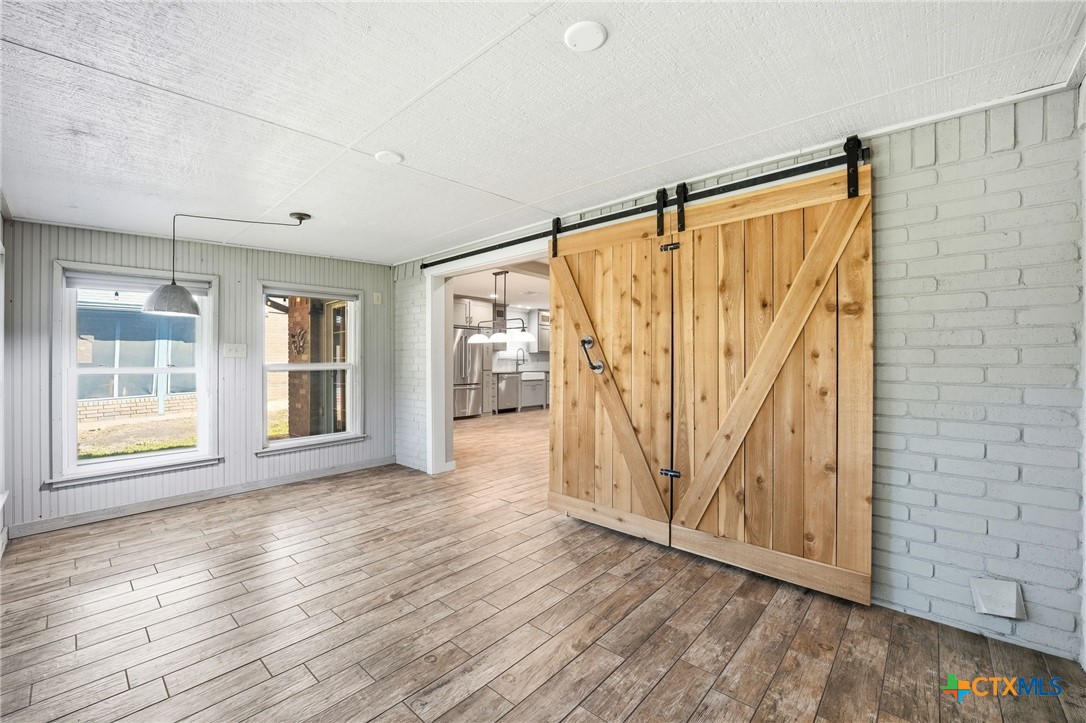 3624 Fox Run Schertz, TX 78108 - Photo 13 of 46 an entryway at an empty room with wooden floor and a window