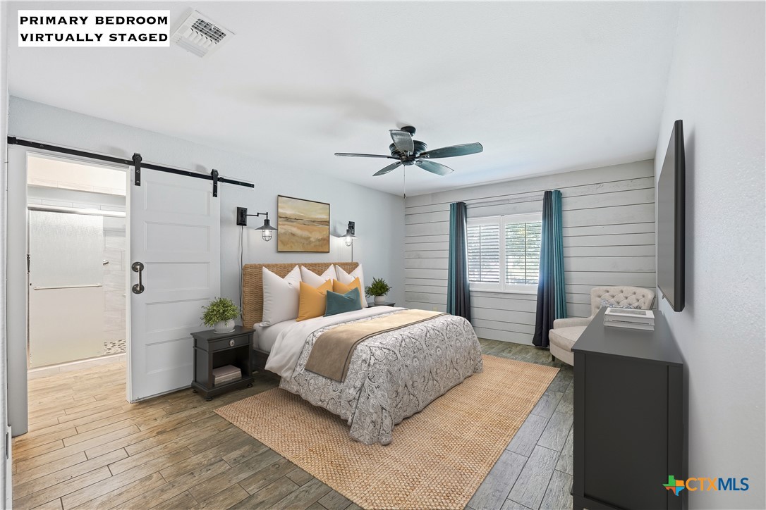 3624 Fox Run Schertz, TX 78108 - Photo 17 of 46 a bedroom with a bed and a chandelier