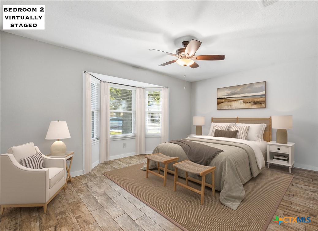 3624 Fox Run Schertz, TX 78108 - Photo 22 of 46 a spacious bedroom with a bed and a chandelier