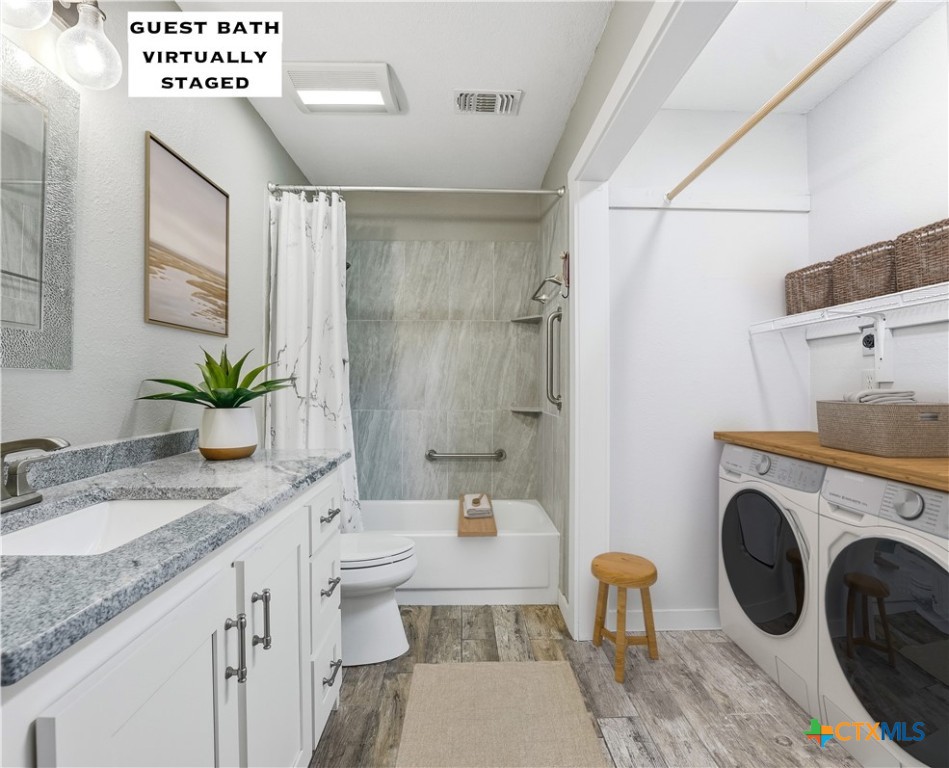 3624 Fox Run Schertz, TX 78108 - Photo 25 of 46 a spacious bathroom with a granite countertop sink a mirror and a bathtub