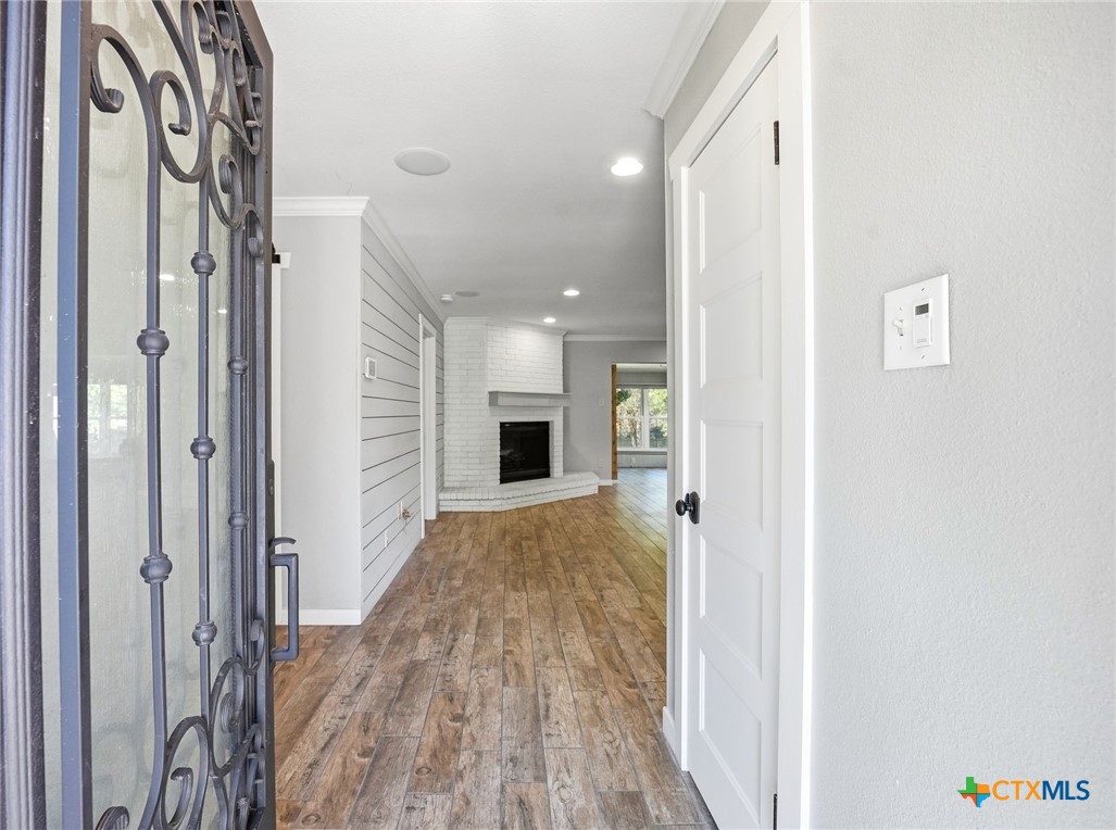 3624 Fox Run Schertz, TX 78108 - Photo 4 of 46 a view of a hallway with wooden floor and staircase