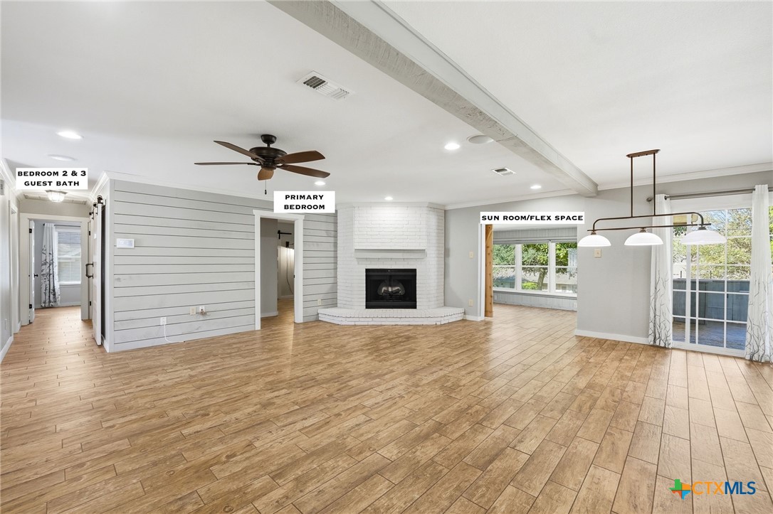 3624 Fox Run Schertz, TX 78108 - Photo 7 of 46 a view of an empty room with wooden floor and a window