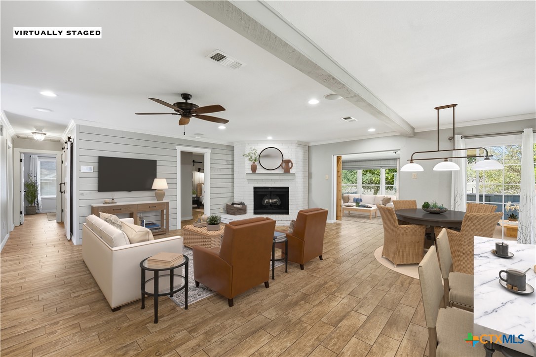 3624 Fox Run Schertz, TX 78108 - Photo 8 of 46 a living room with fireplace furniture and a flat screen tv