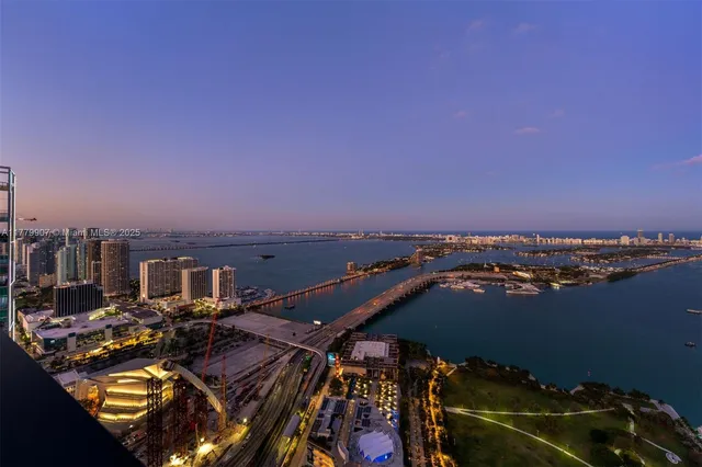 an aerial view of a house with a ocean view