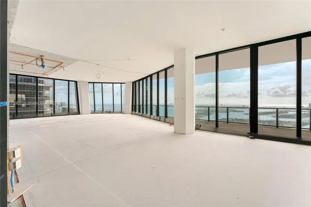 a view of an empty room with a balcony