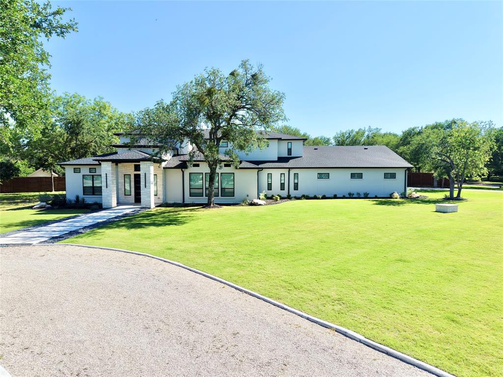 428 Squaw Creek Road Willow Park, TX 76087 - Photo 5 of 34 a house with swimming pool in front of it