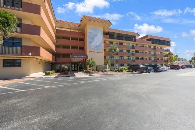 a city street lined with buildings and cars