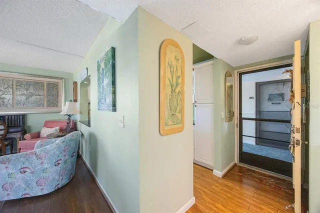 a view of a swimming pool with a patio and a yard