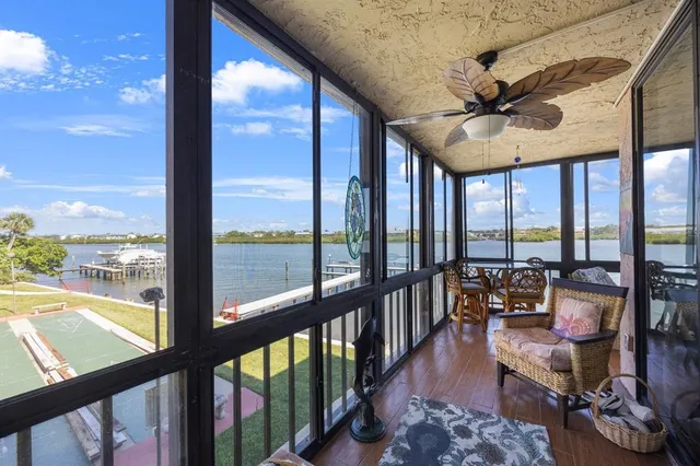 a view of a city from a balcony with furniture