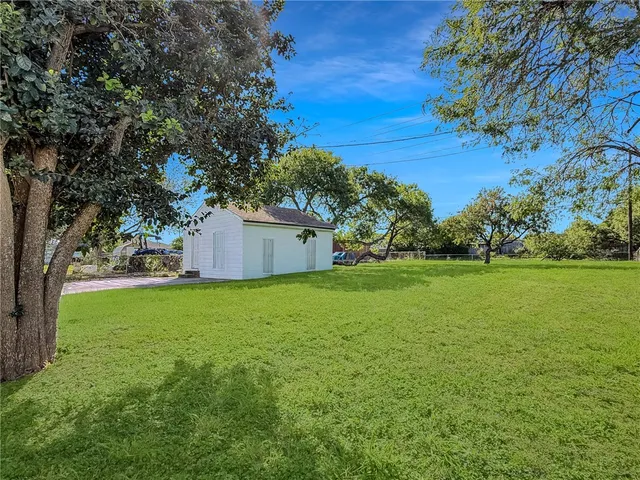 a backyard of a house with lots of green space