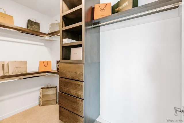 a kitchen with a refrigerator and cabinets