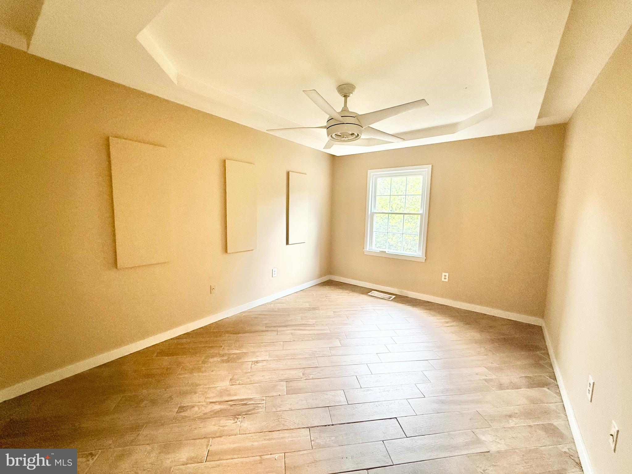 5439 Richenbacher Avenue Alexandria, VA 22304 - Photo 9 of 23 a view of an empty room with window and chandelier fan