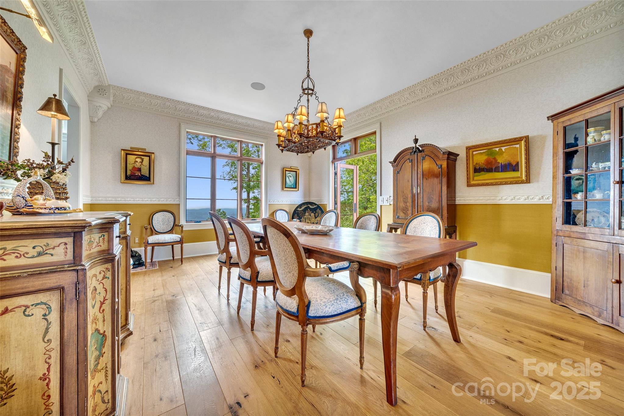 278 North Snow Ridge Drive Fairview, NC 28730 - Photo 12 of 48 a view of a dining room with furniture and wooden floor
