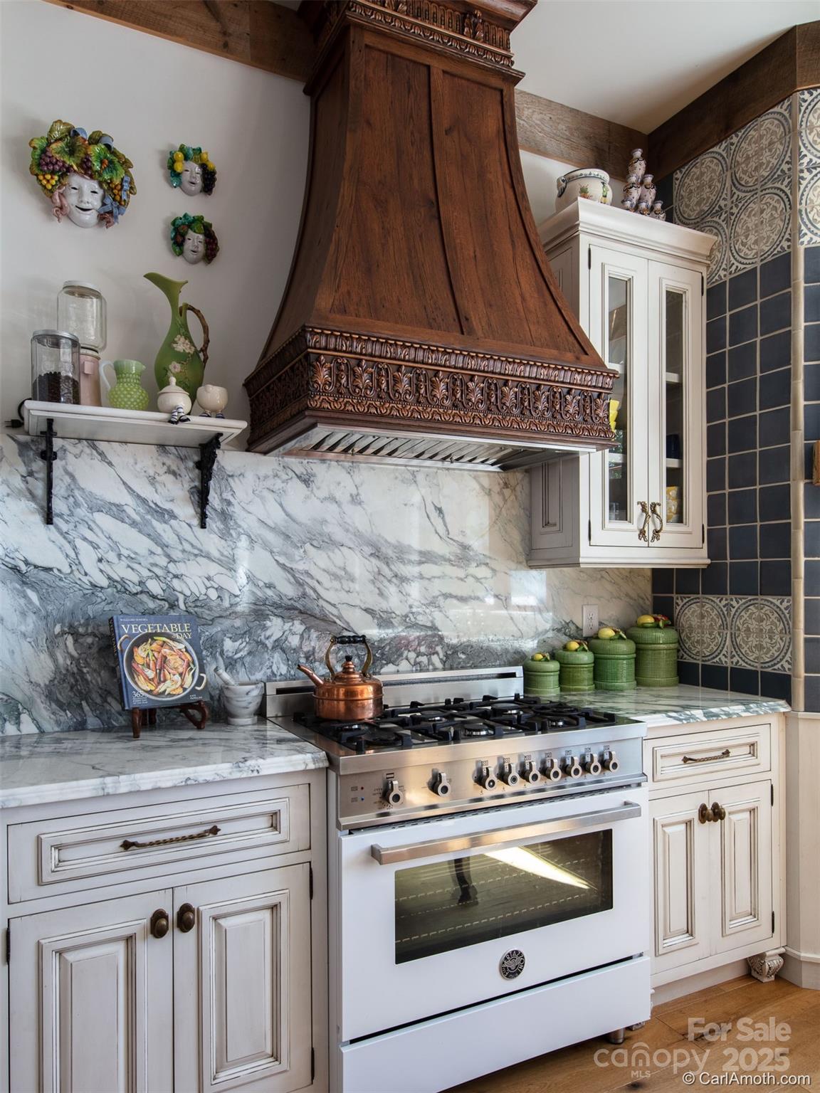 278 North Snow Ridge Drive Fairview, NC 28730 - Photo 17 of 48 a stove top oven sitting inside of a kitchen