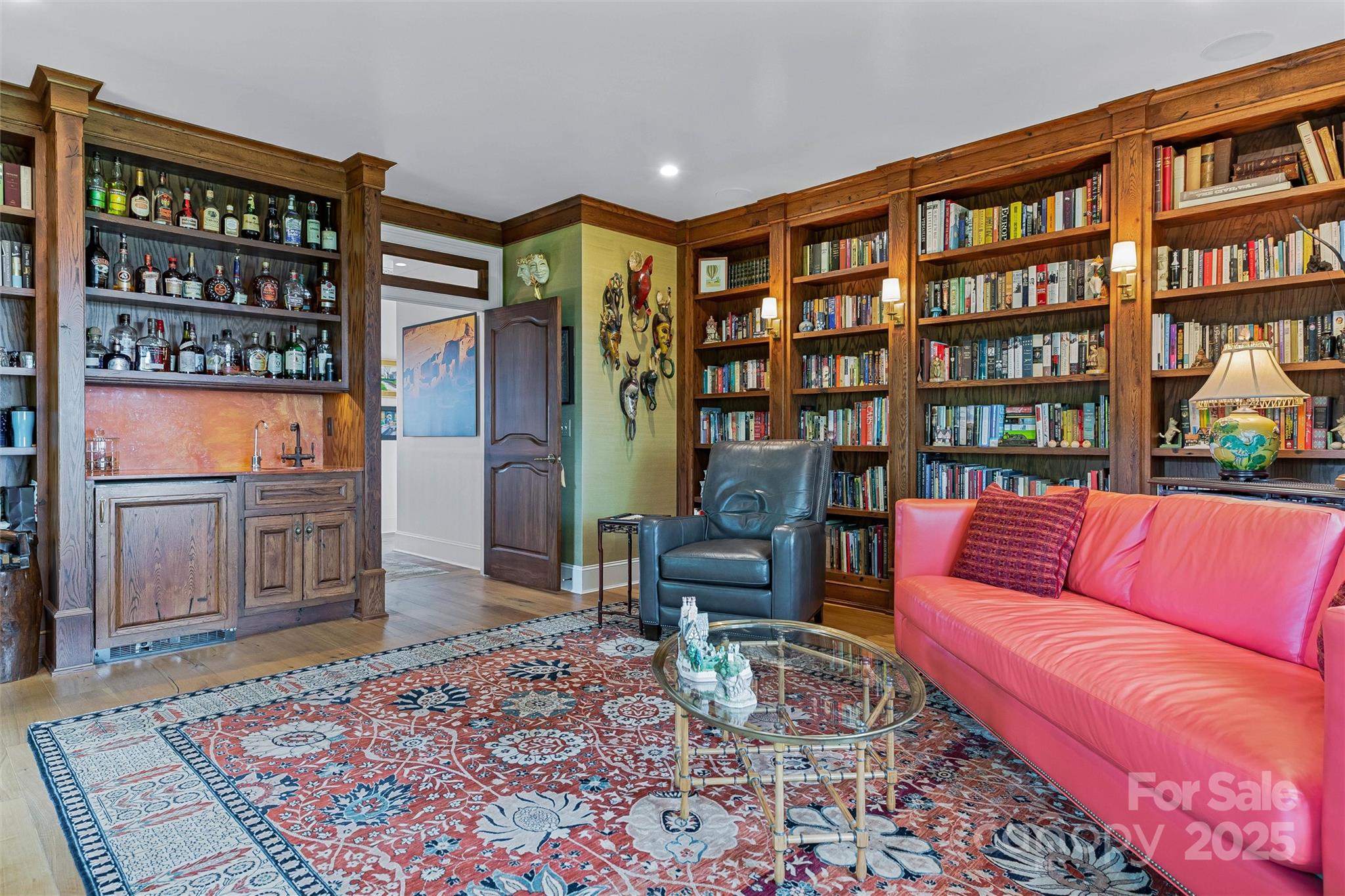 278 North Snow Ridge Drive Fairview, NC 28730 - Photo 22 of 48 a living room with furniture a rug and a book shelf