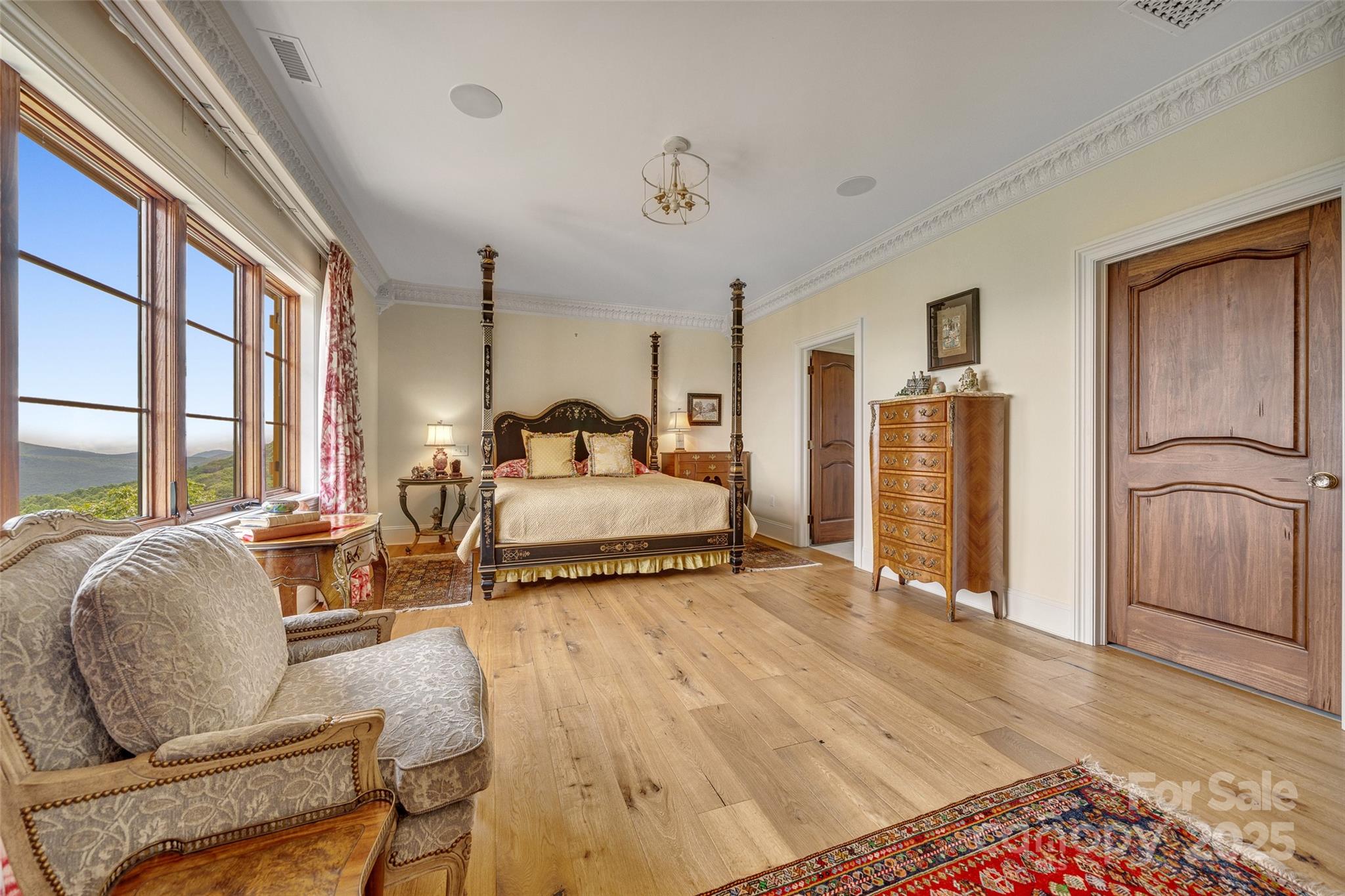 278 North Snow Ridge Drive Fairview, NC 28730 - Photo 24 of 48 a bedroom with double bed and a large window