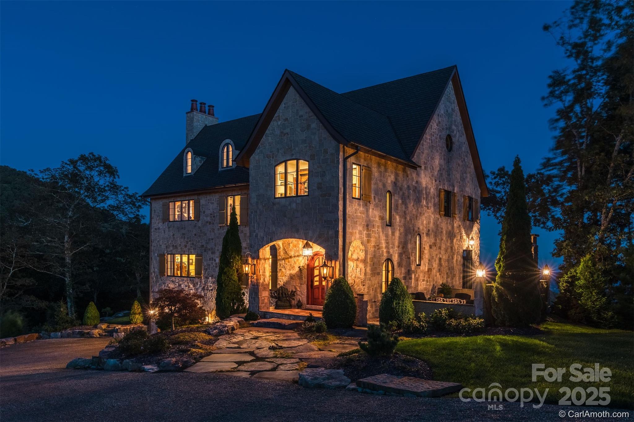 278 North Snow Ridge Drive Fairview, NC 28730 - Photo 3 of 48 a front view of a house with a yard