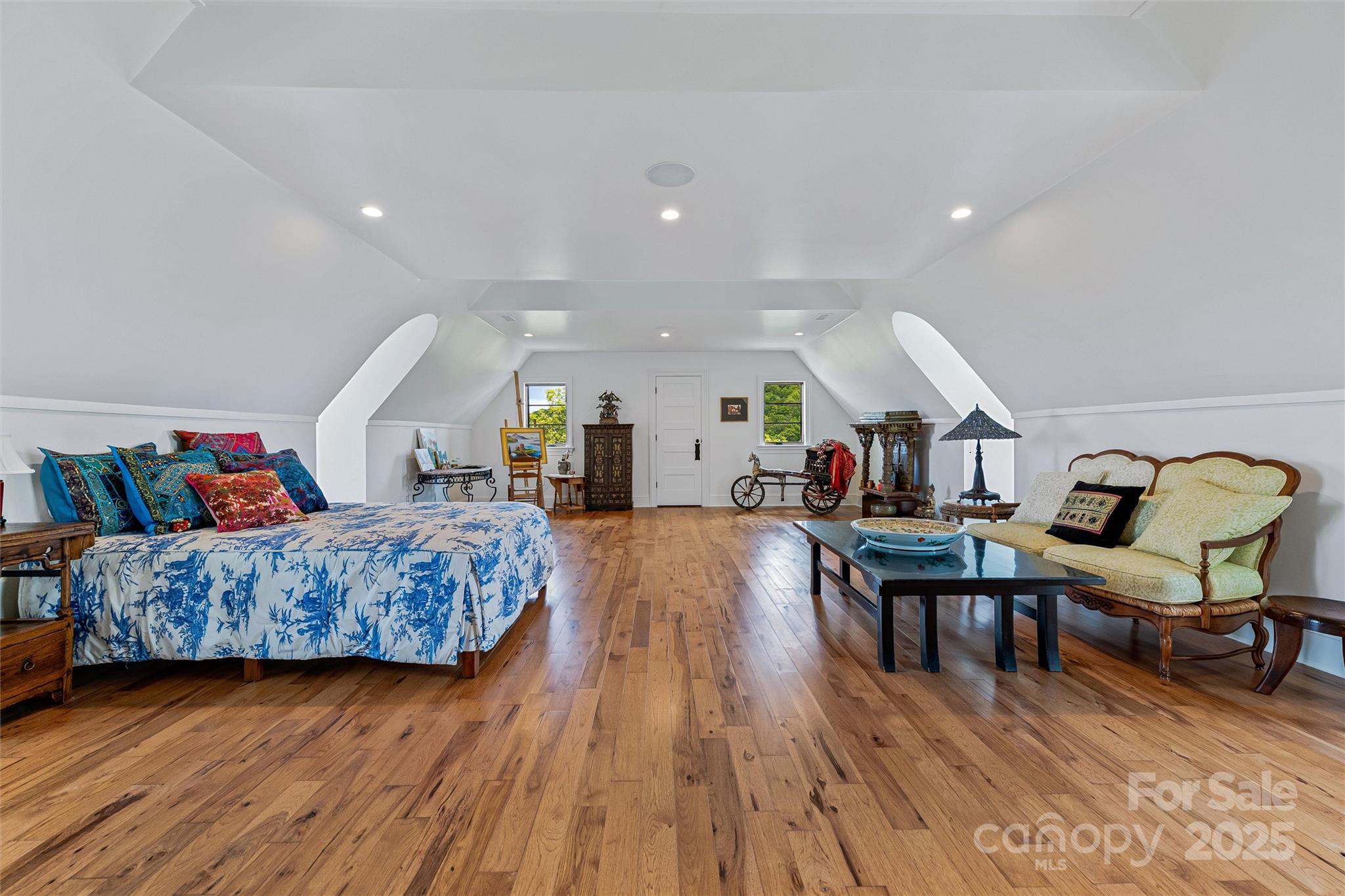 278 North Snow Ridge Drive Fairview, NC 28730 - Photo 32 of 48 a living room with furniture and a wooden floor