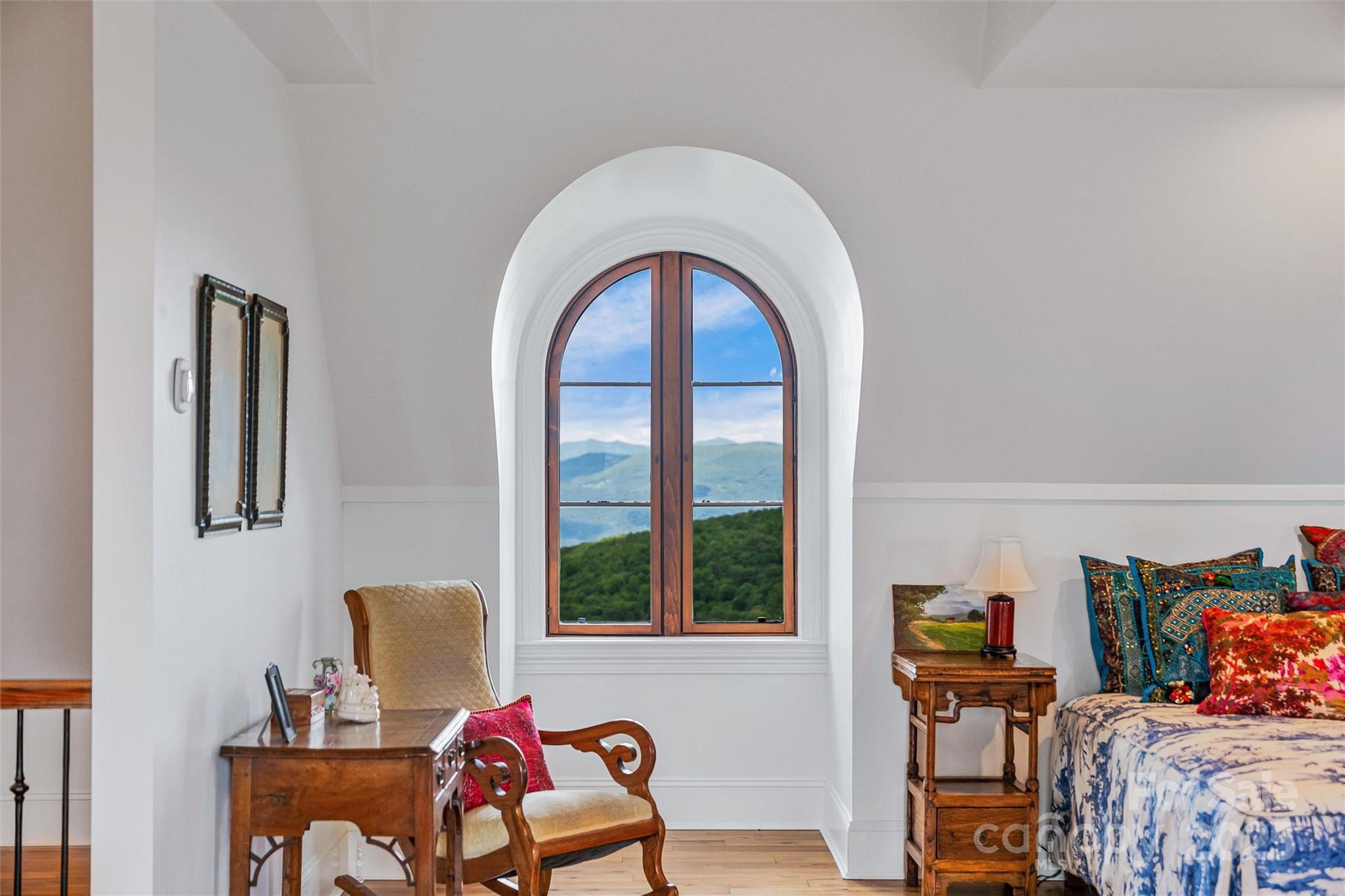 278 North Snow Ridge Drive Fairview, NC 28730 - Photo 34 of 48 a bedroom with furniture and a window
