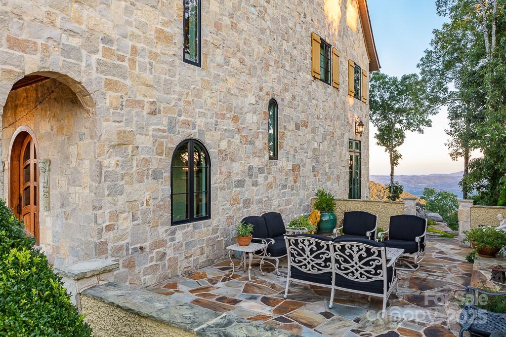 278 North Snow Ridge Drive Fairview, NC 28730 - Photo 39 of 48 a front view of a house with outdoor seating