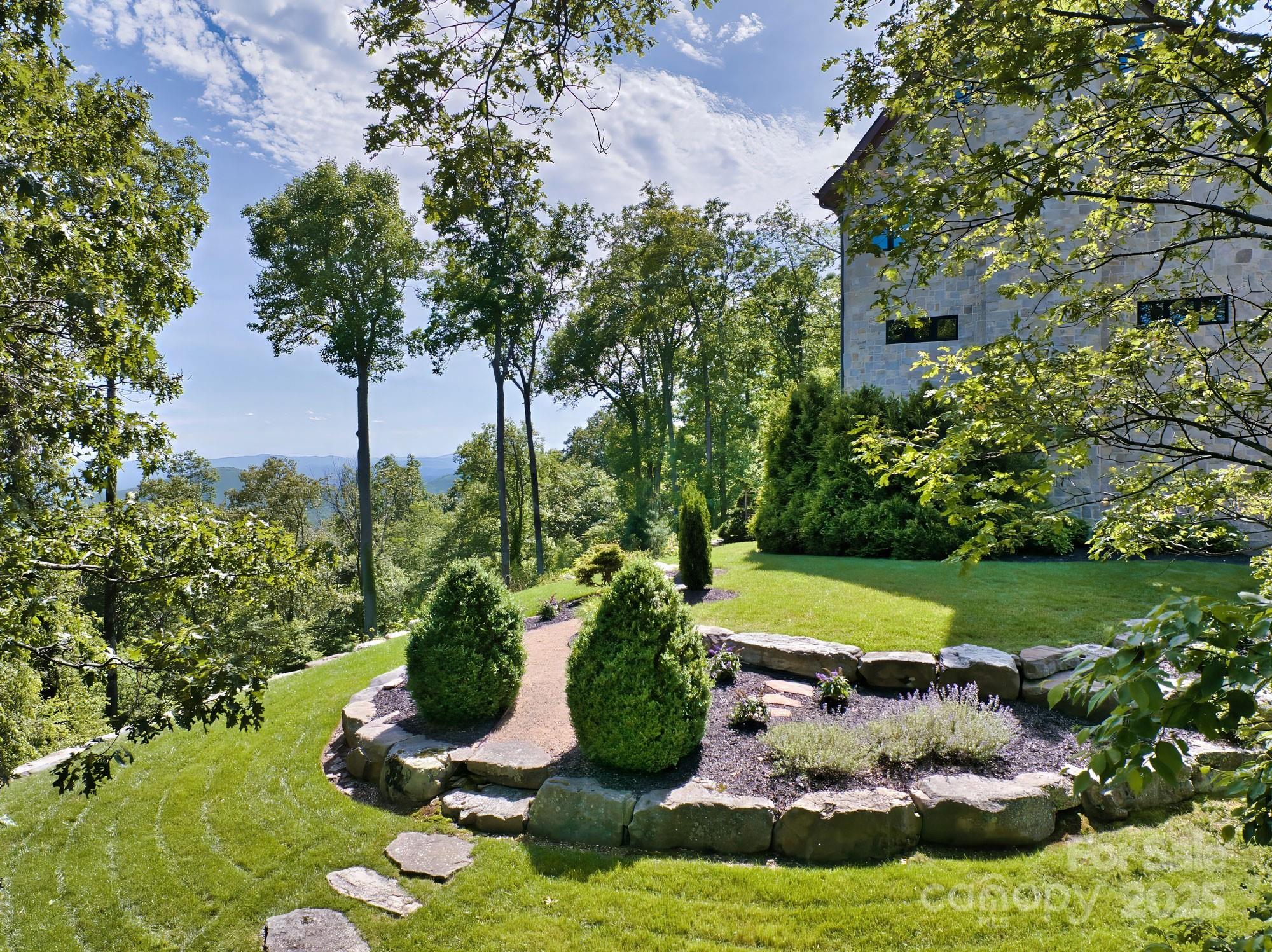 278 North Snow Ridge Drive Fairview, NC 28730 - Photo 42 of 48 a view of a swimming pool with a garden