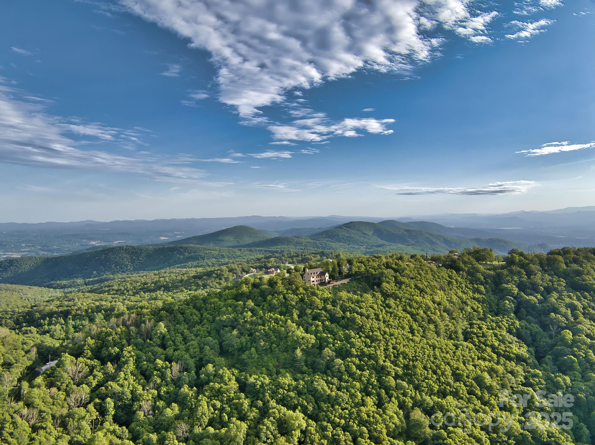 278 North Snow Ridge Drive Fairview, NC 28730 - Photo 43 of 48 a view of a lake and a yard