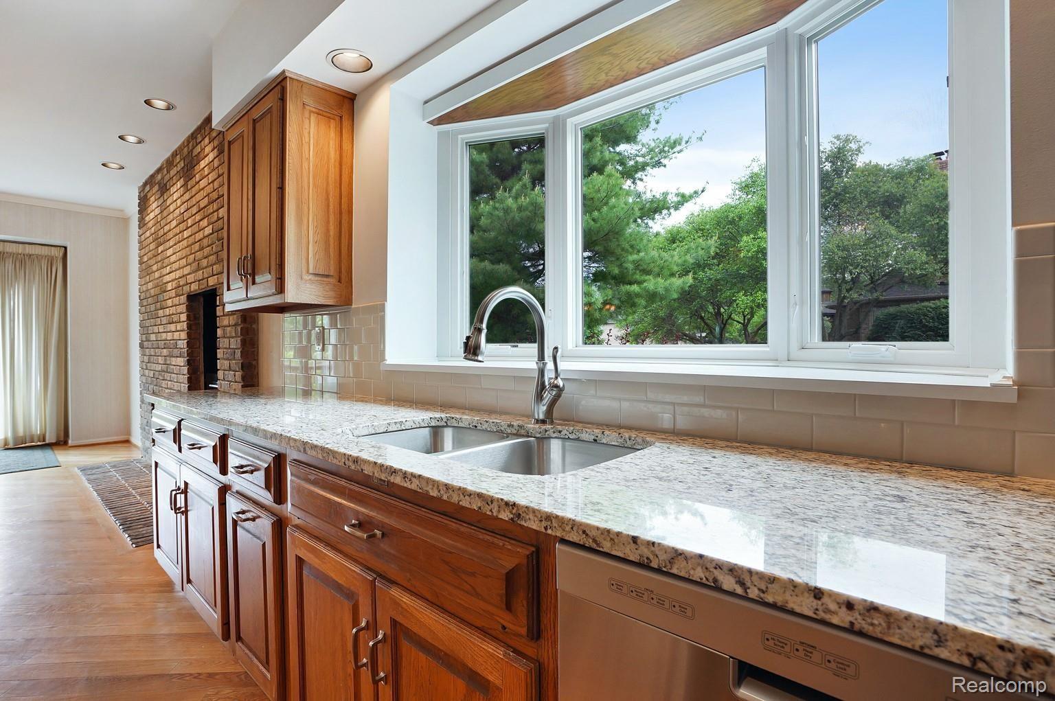 1023 Stony Pointe Boulevard Rochester, MI 48307 - Photo 14 of 43 Kitchen sink area with new double sinks