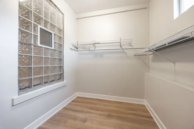 a view of an empty room with a window