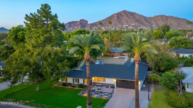 an aerial view of a house with a garden