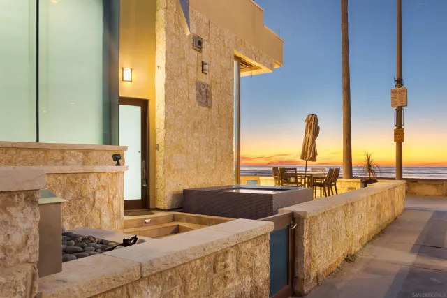 an aerial view of a house with wooden stairs