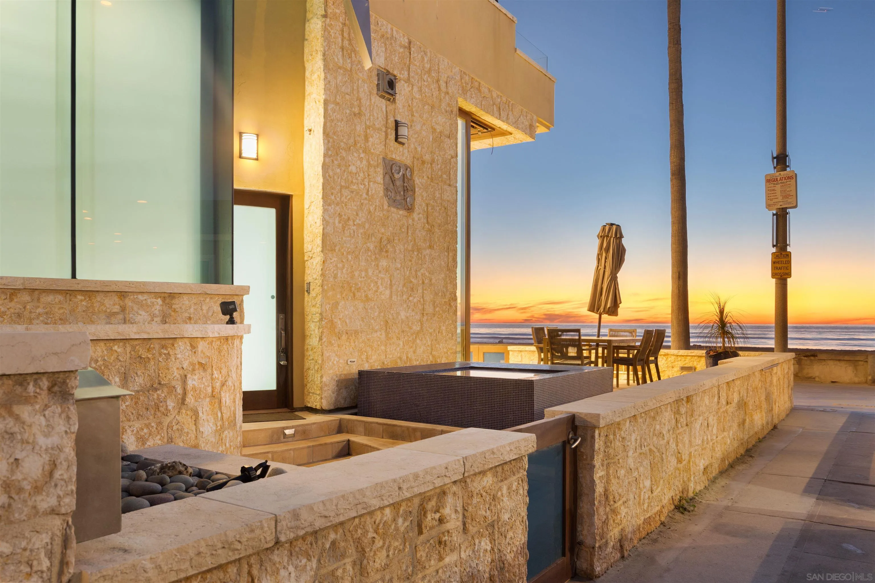 3921 Ocean Front Walk San Diego, CA 92109 - Photo 21 of 32 a dining table with chairs and window