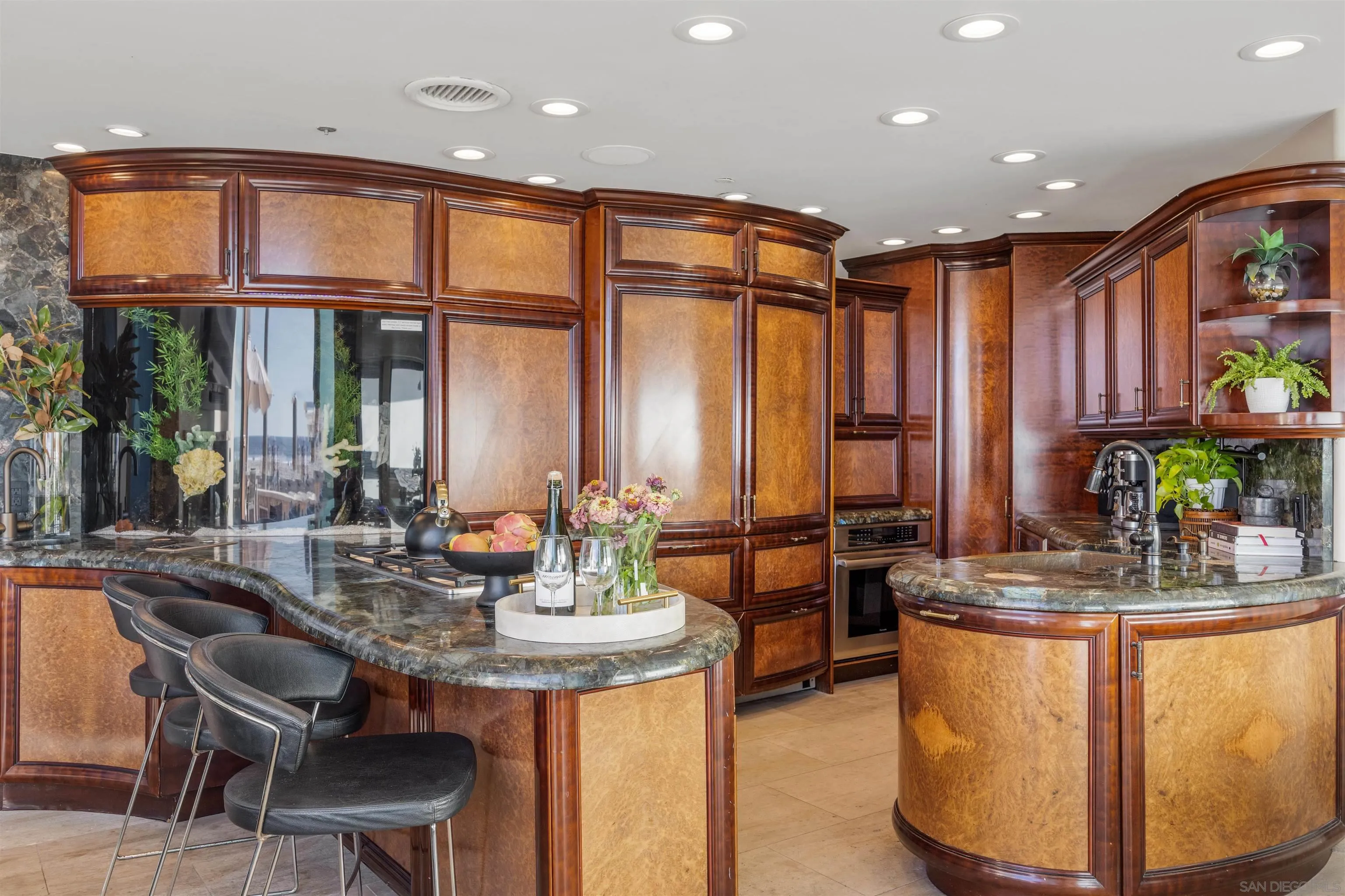 3921 Ocean Front Walk San Diego, CA 92109 - Photo 5 of 32 a dining table with chairs and potted plant