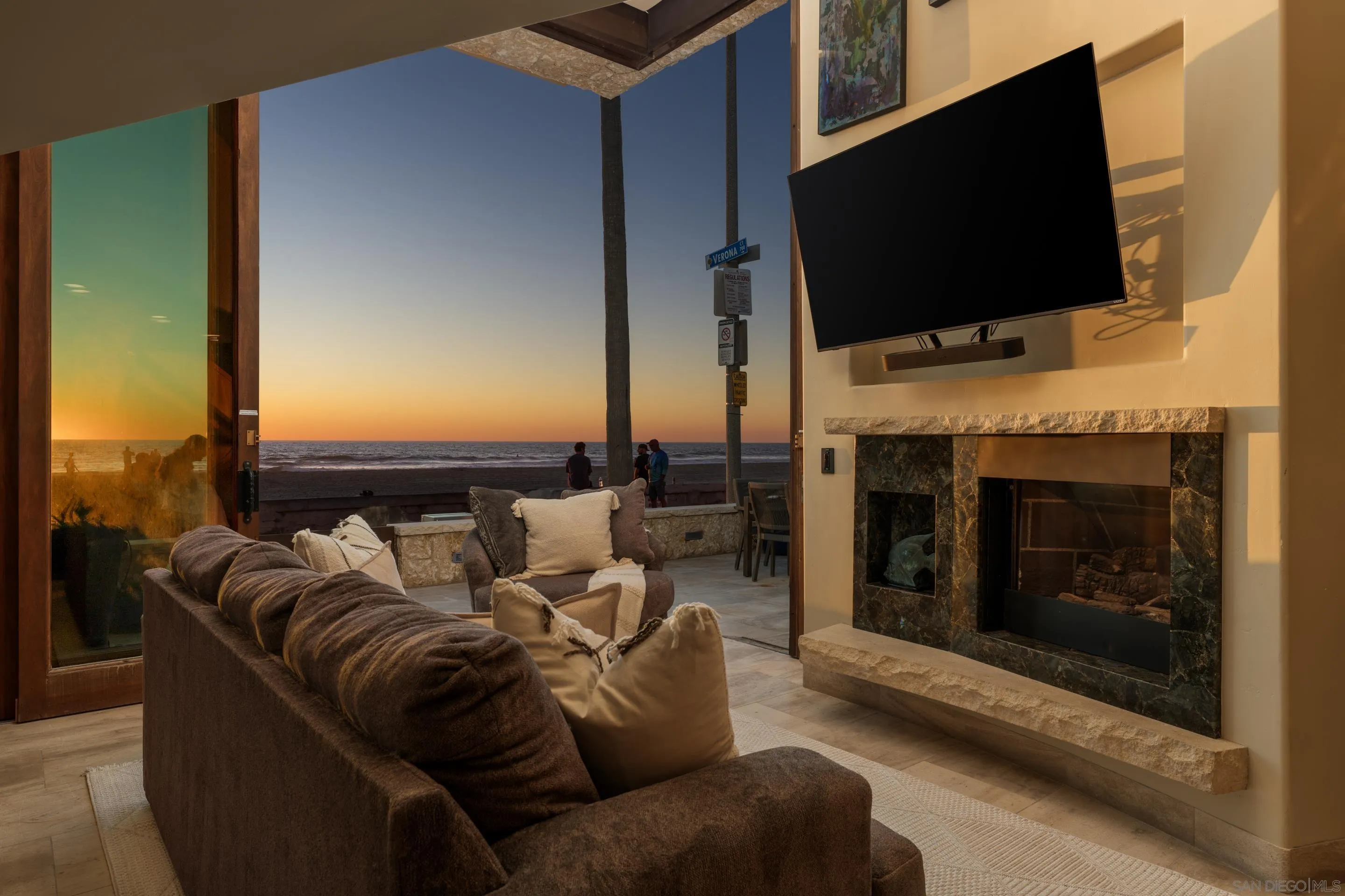 3921 Ocean Front Walk San Diego, CA 92109 - Photo 8 of 32 a living room with furniture and a flat screen tv