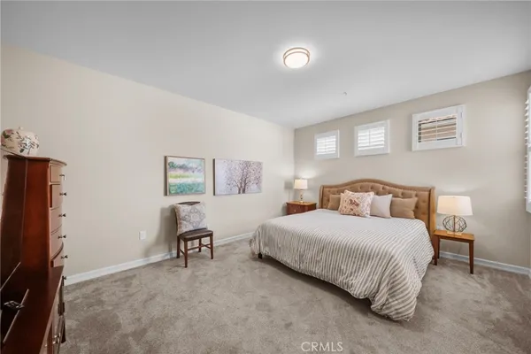 a bedroom with a bed furniture and a window