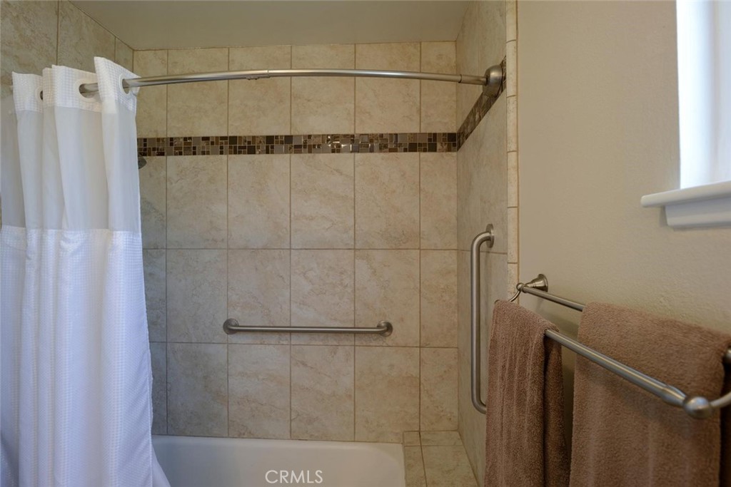10424 Cartilla Court Rancho Cucamonga, CA 91737 - Photo 17 of 36 a bathroom with a shower and a tub